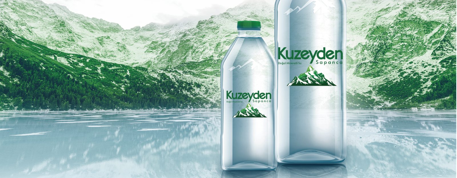Kuzeyden mineral water bottles photographed against a mountain lake